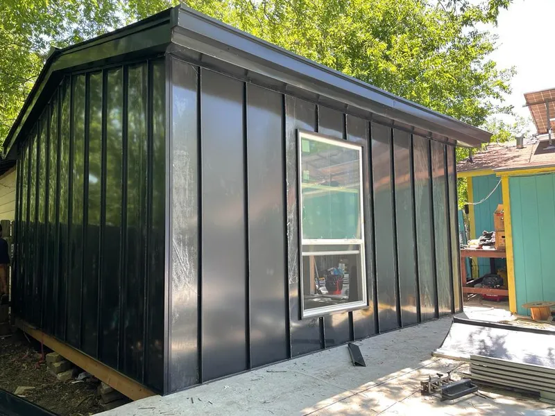 Black standing seam metal wall panels for Metal Roof Installation in Dos Palos