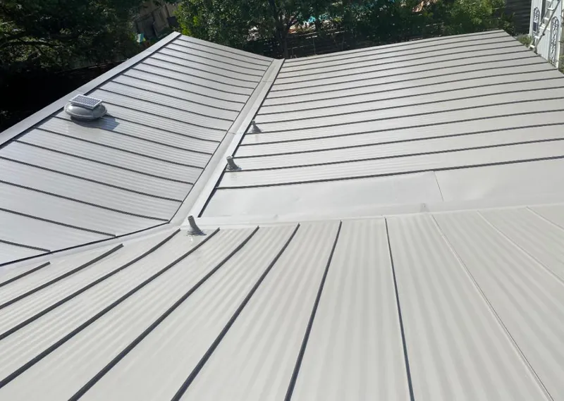 Solar attic fan installed on a metal roof for Roof Ventilation in Dos Palos